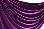 a close-up view of a shiny, purple satin fabric with a smooth, flowing texture.