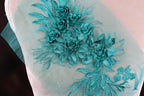 a close up of a dress with flowers on it
