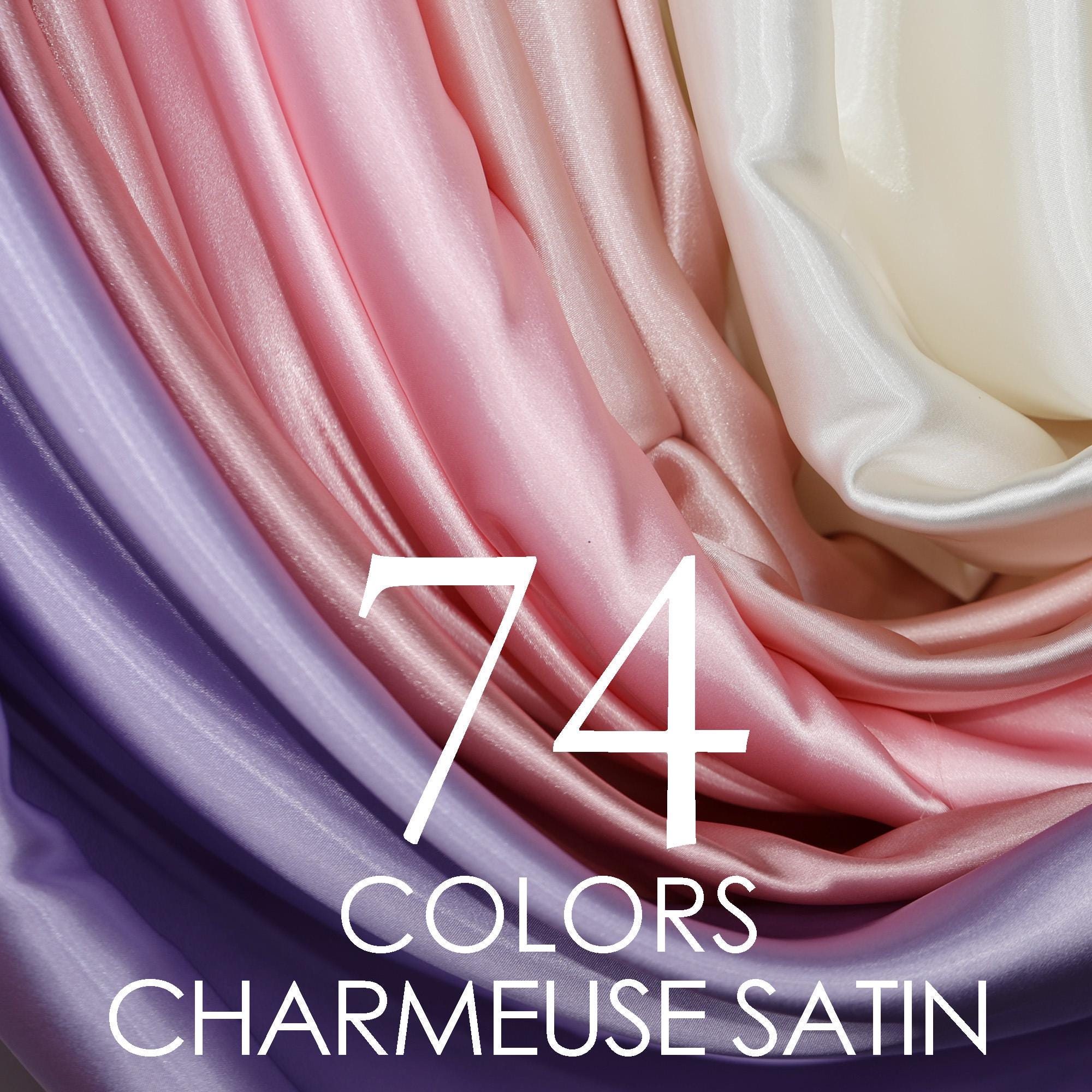 a close-up view of a variety of colorful satin fabric, with the text "74 COLORS CHARMEUSE SATIN" overlaid on the image.