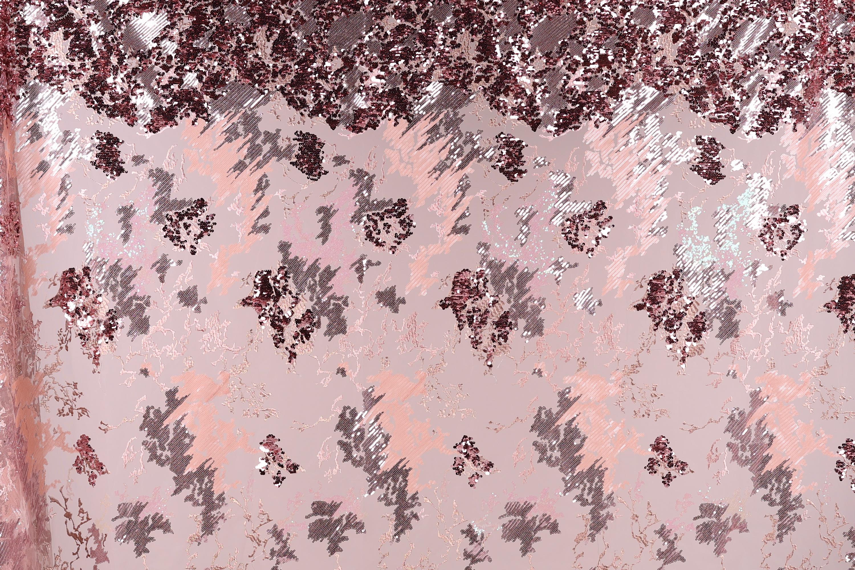 The image is a collage of various pink and purple sequin patterns, creating a visually striking and textured background.