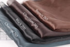 A close-up image of three fabric swatches, each with a different color and labeled with the name of the fabric.