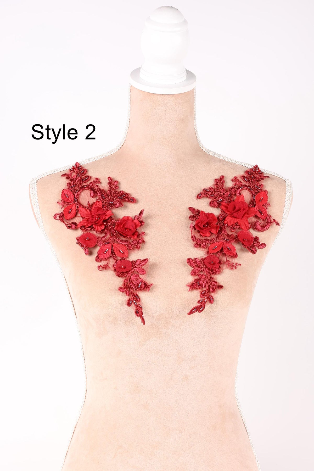 A mannequin with red floral embroidery on its shoulders, labeled as "Style 2".