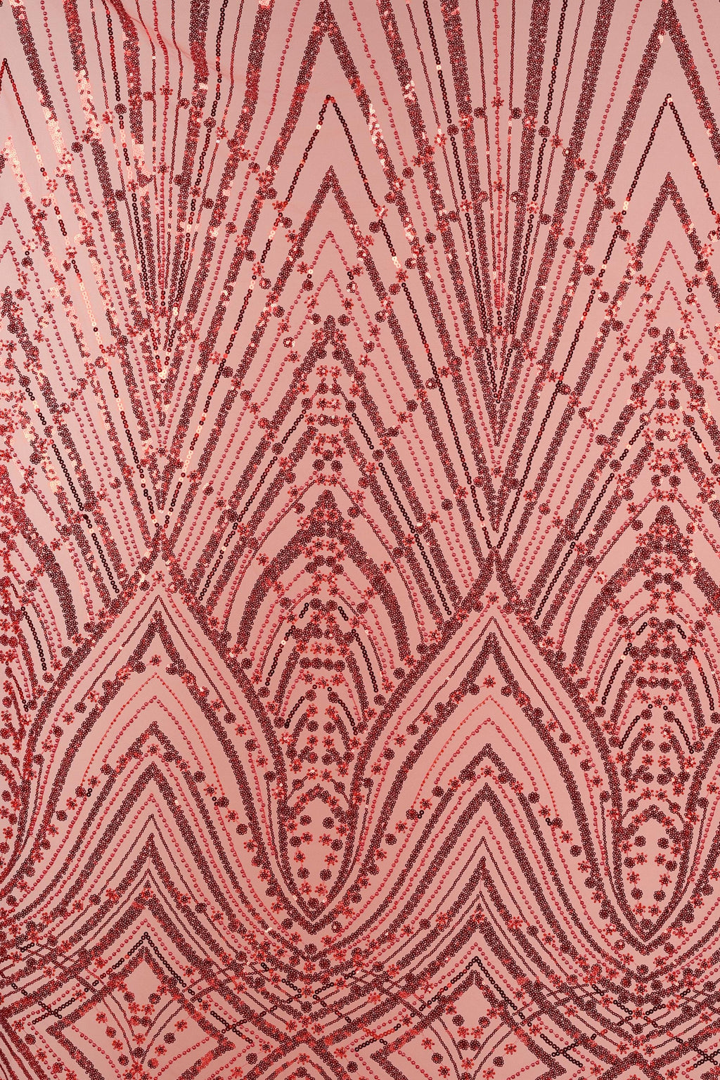 a close-up view of a fabric with a repeating pattern of red and black lines and dots, creating a visually striking and intricate design.