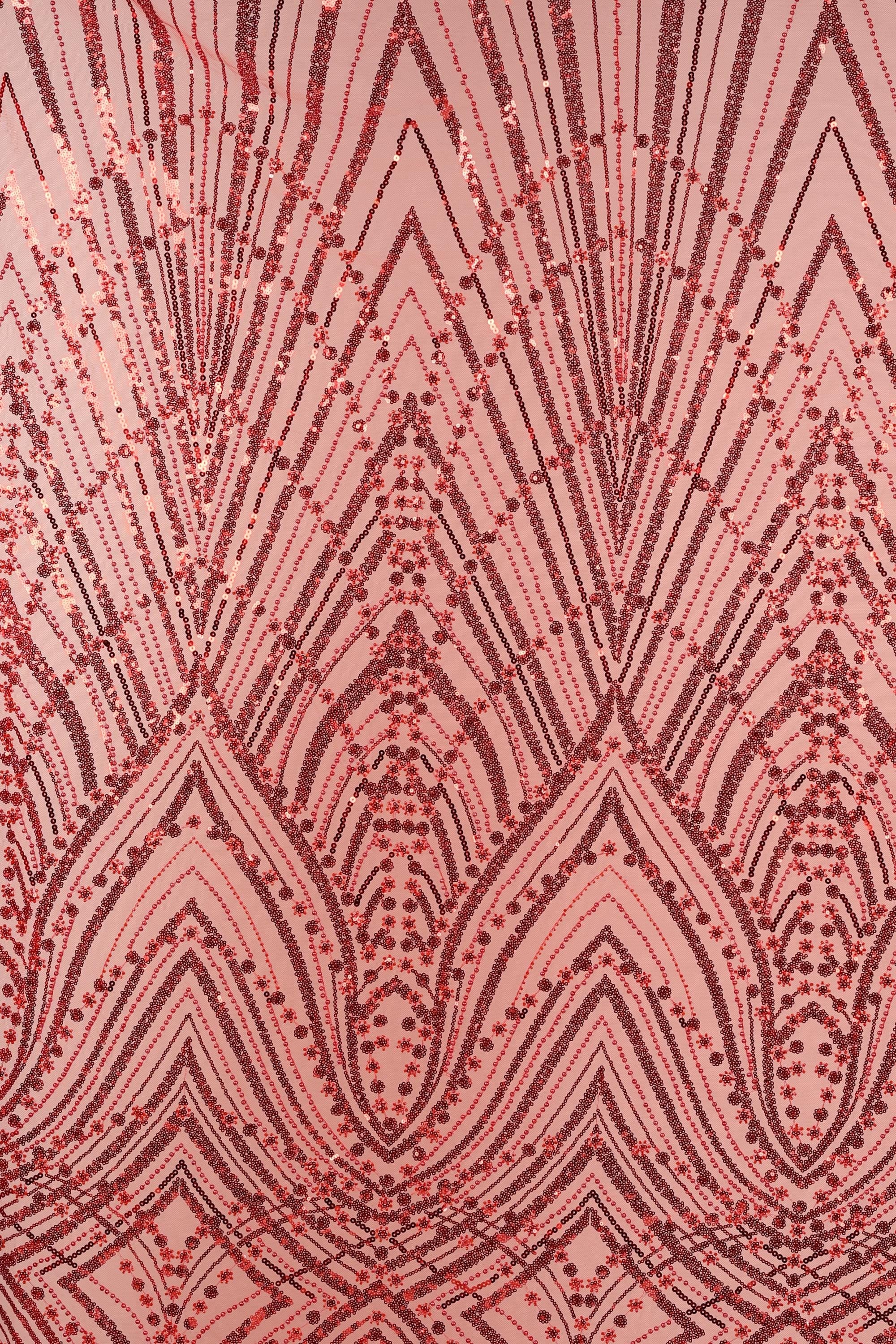a close-up view of a fabric with a repeating pattern of red and black lines and dots, creating a visually striking and intricate design.
