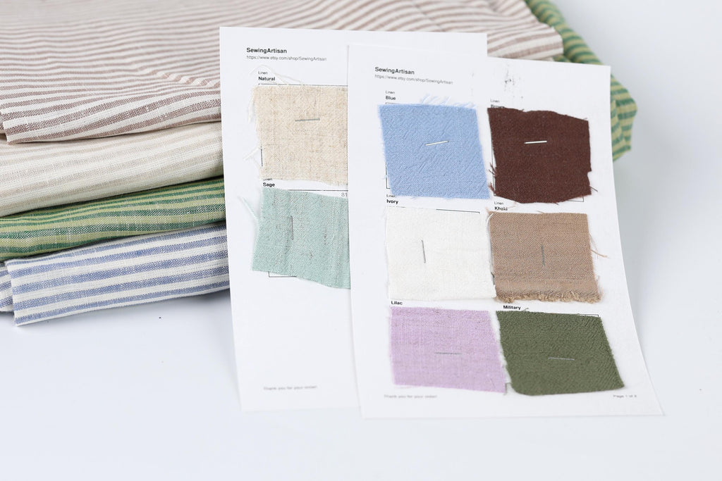 a collection of fabric swatches, each with a different color and pattern, arranged on a white surface.