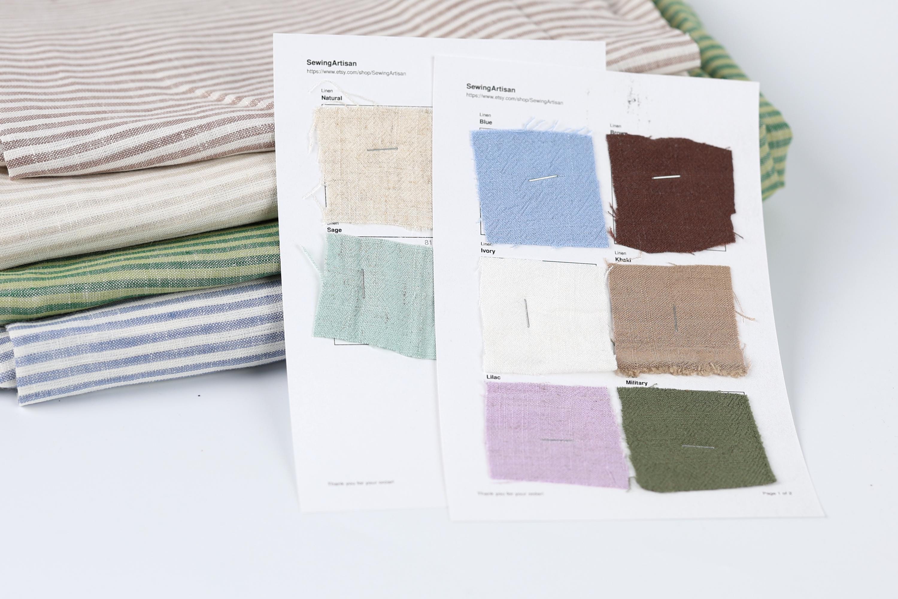 a collection of fabric swatches, each with a different color and pattern, arranged on a white surface.