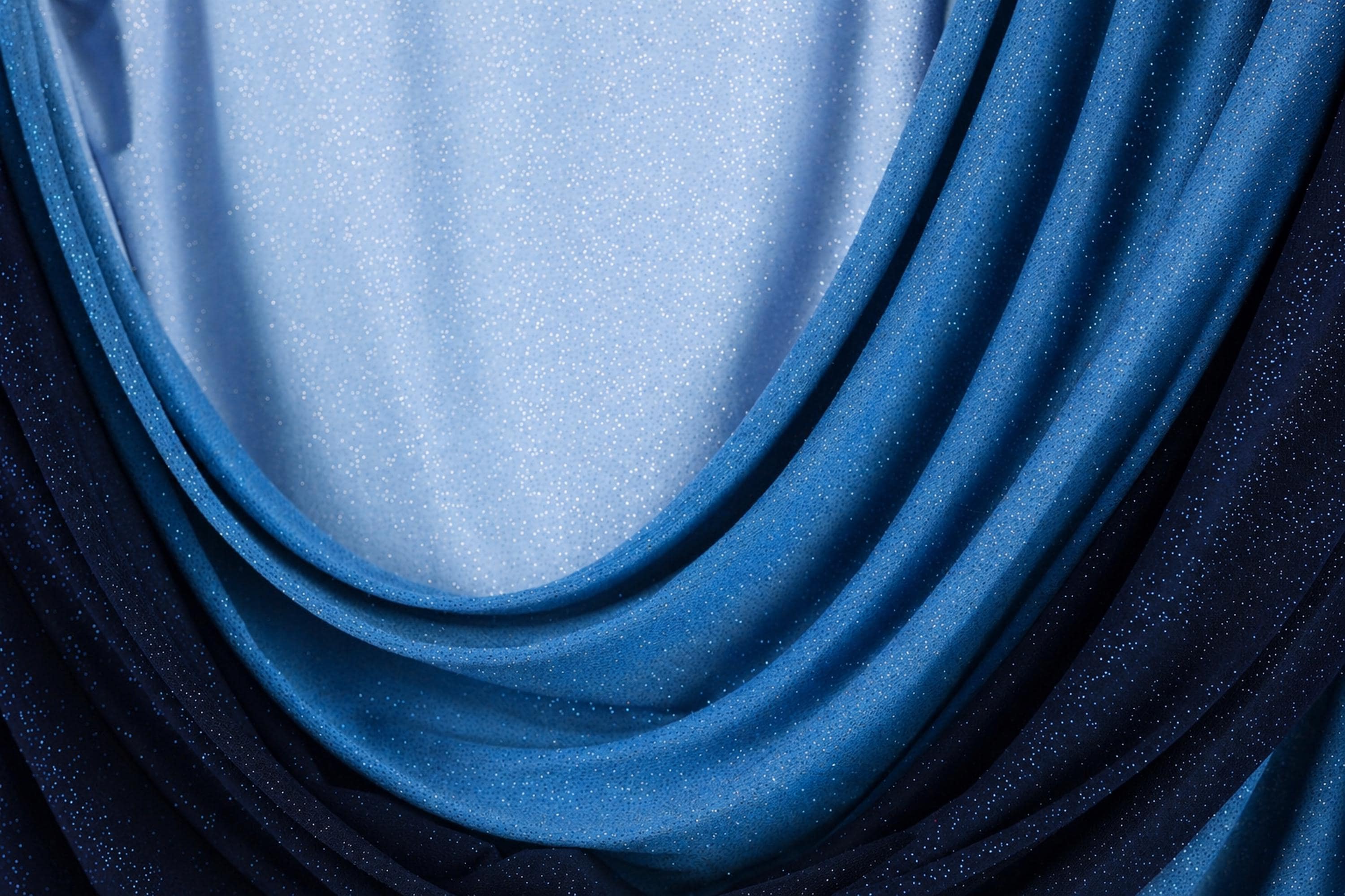 a close-up view of a fabric with blue and black hues, creating a visually striking contrast.