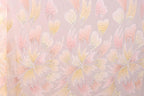 a repeating pattern of pink and yellow flowers with sparkles on a light pink background.