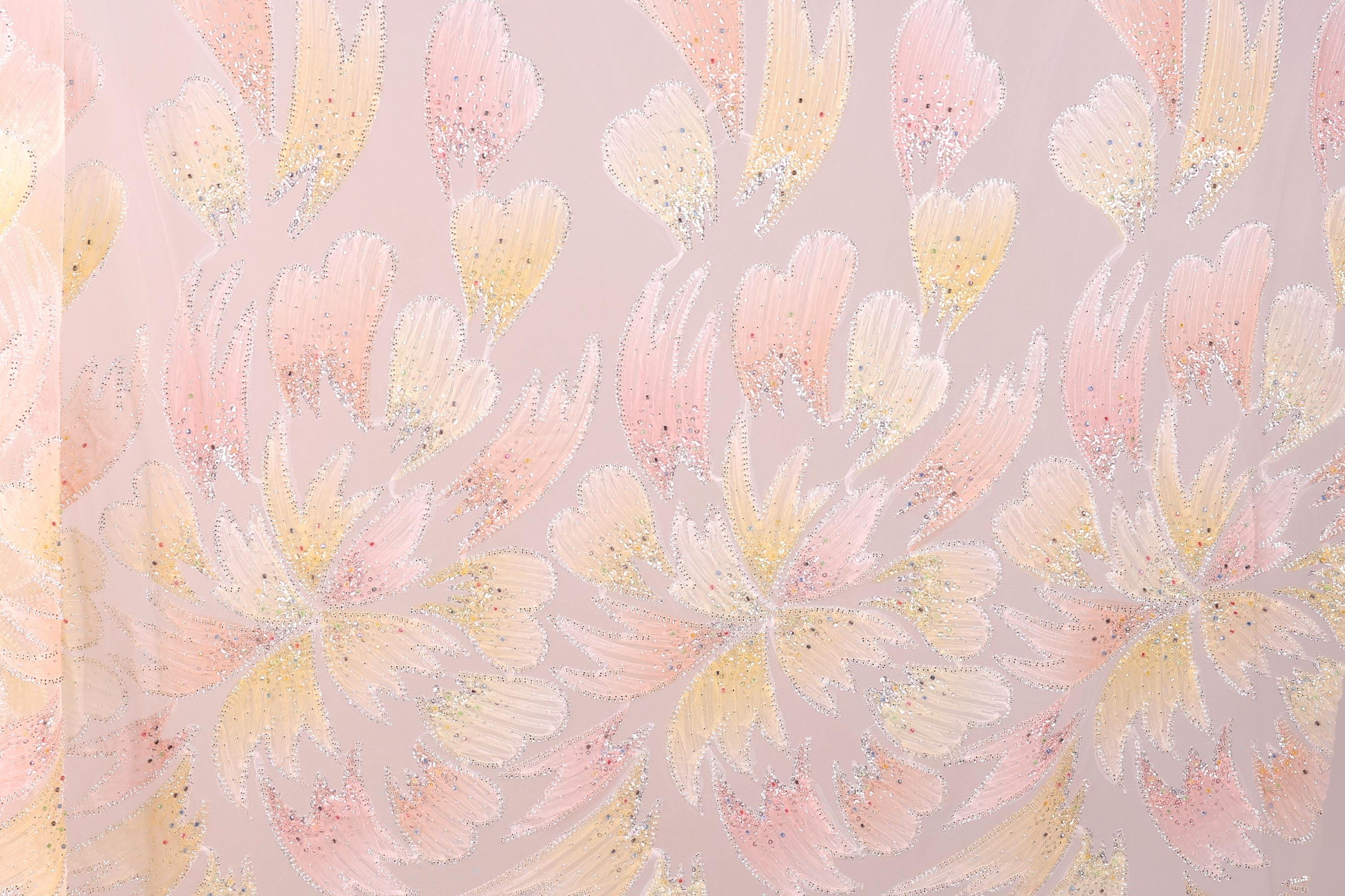a repeating pattern of pink and yellow flowers with sparkles on a light pink background.