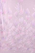 a pattern of pink and purple flowers with glittering details, creating a visually striking and intricate design.