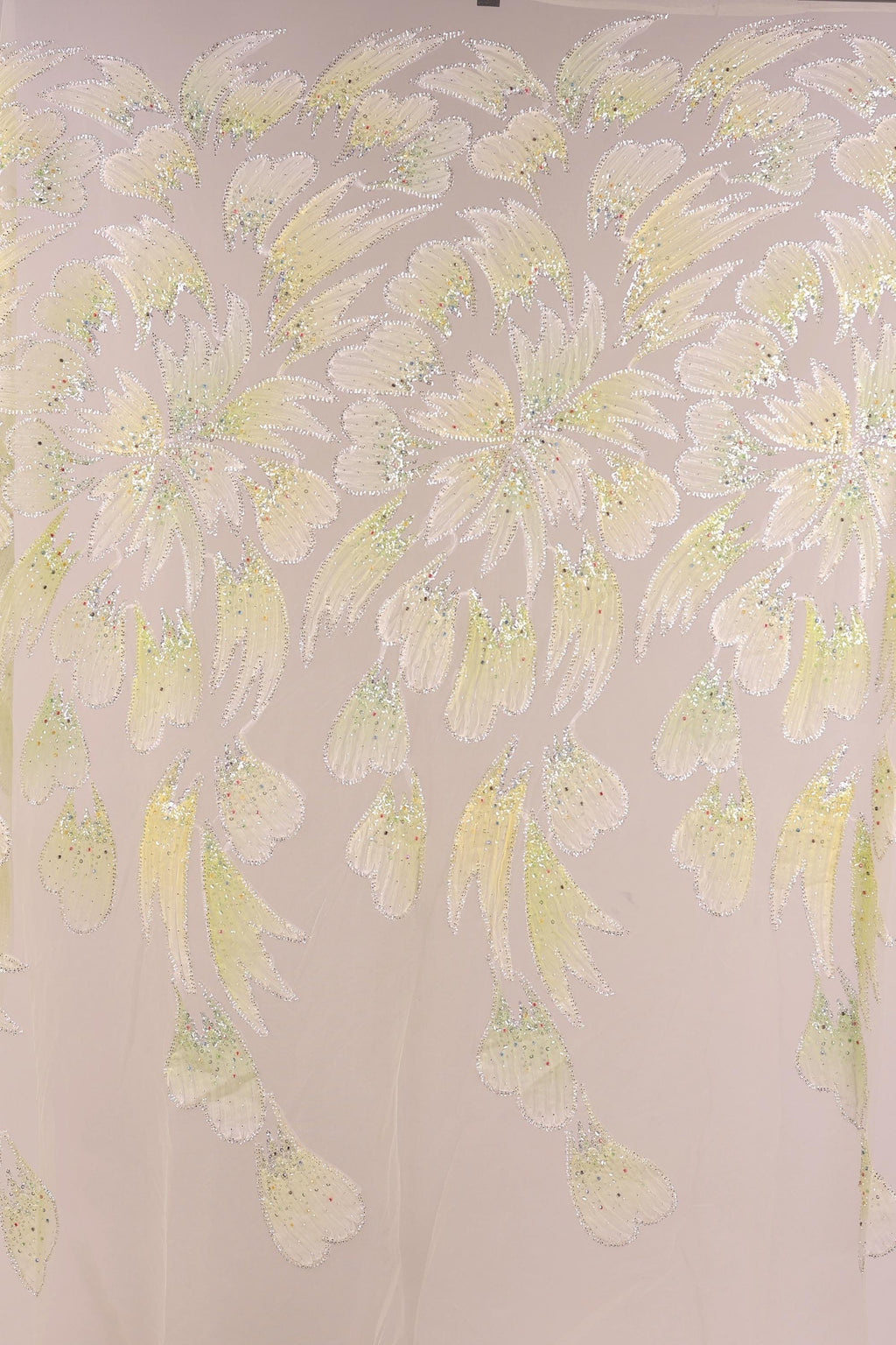 a repeating pattern of yellow and green leaves or flowers, creating a visually striking and intricate design.