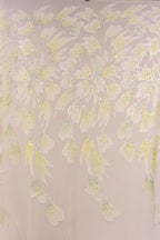 a repeating pattern of yellow and green leaves or flowers, creating a visually striking and intricate design.