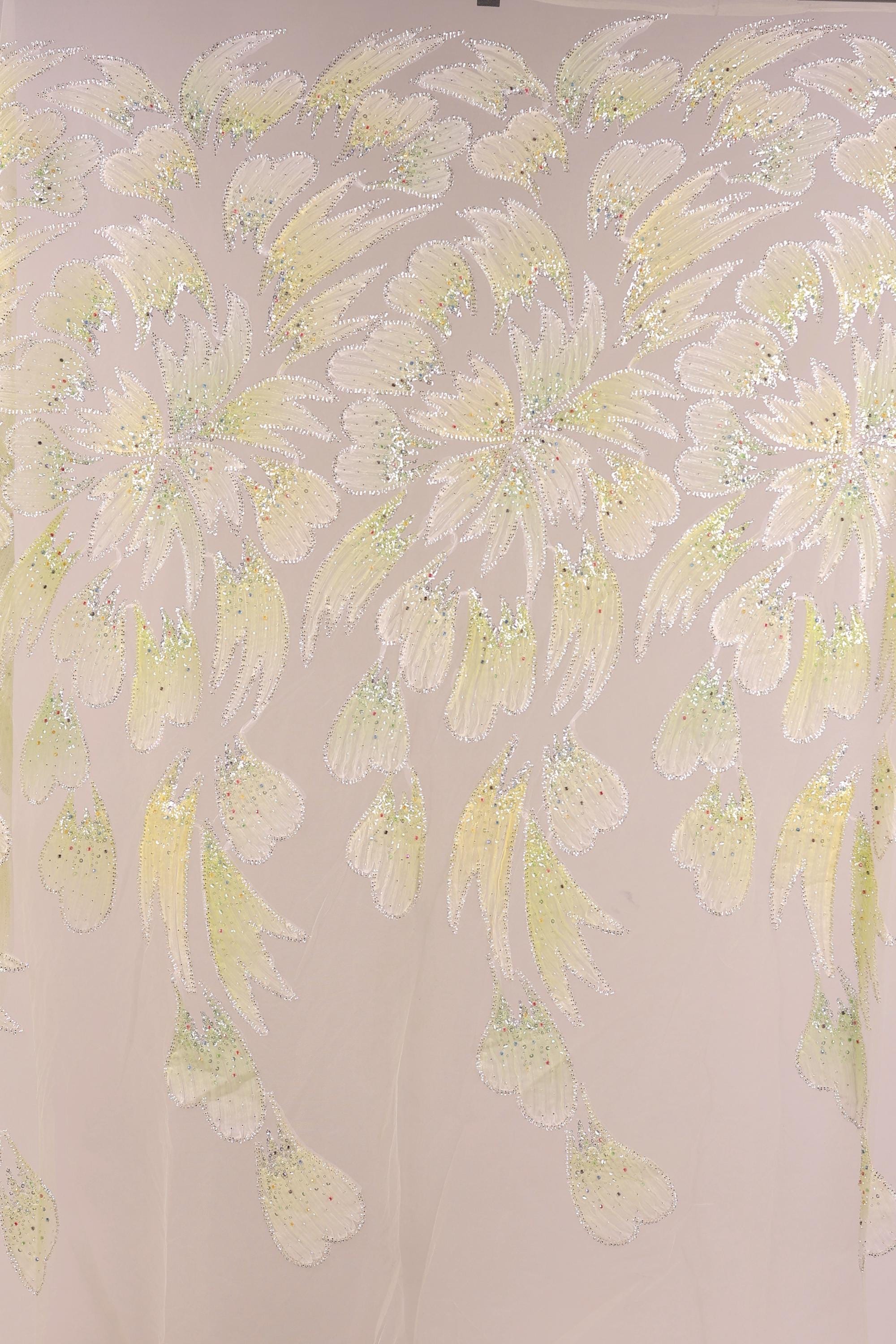 a repeating pattern of yellow and green leaves or flowers, creating a visually striking and intricate design.