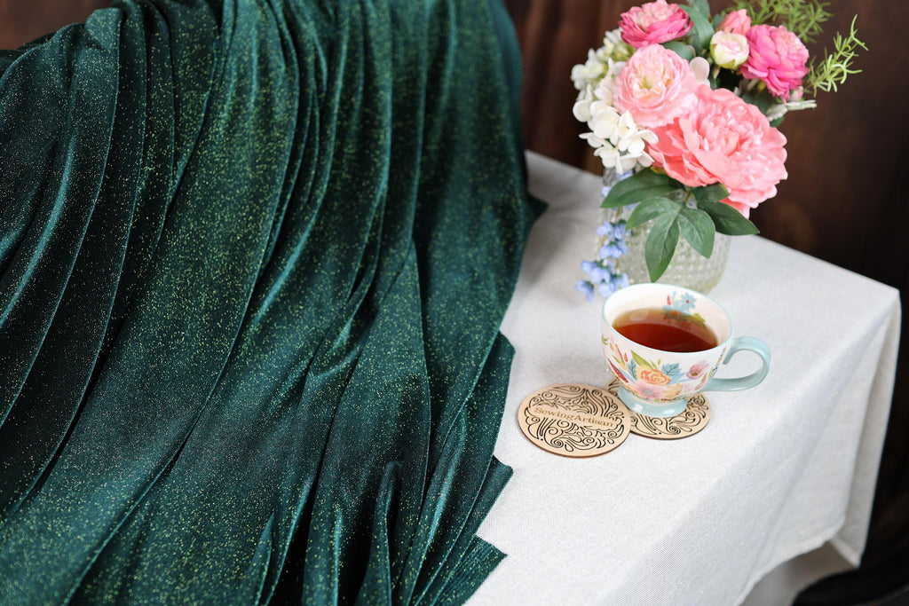 a cup of tea and some flowers on a table