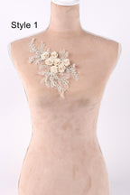 A mannequin with a floral embroidered patch on its chest.