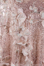 The image is a close-up of a delicate, pink sequined dress with intricate floral embroidery.
