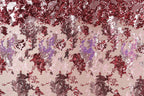 The image is a collage of various images, including a pink and red background with a pattern of red and pink glitter or sequins, as well as other abstract shapes and patterns in shades of pink and red.