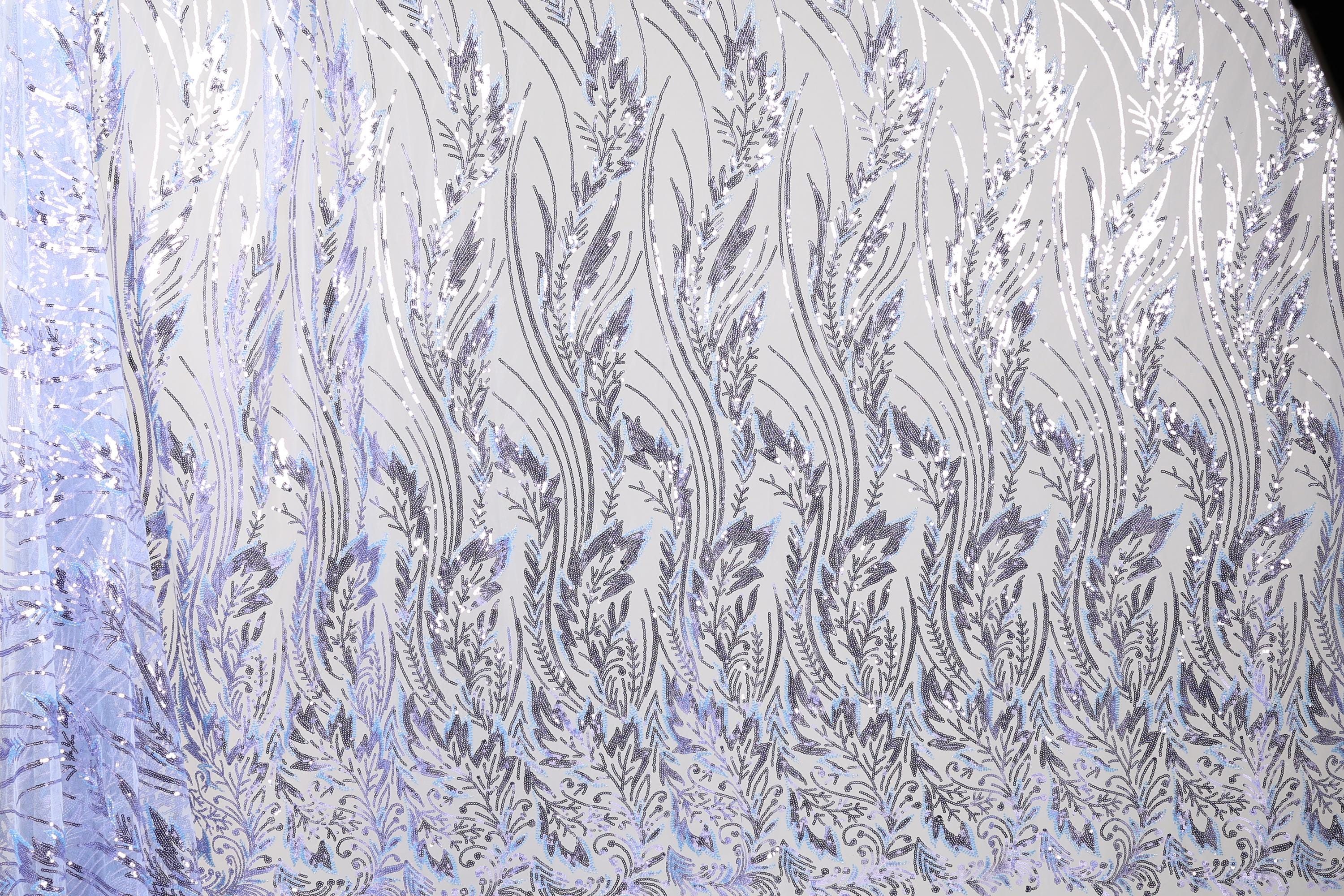 a close-up view of a fabric with a repeating pattern of silver and white leaves or flowers. The pattern is intricate and detailed, creating a visually striking and elegant design.
