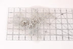 a close-up view of a clear ruler with a floral pattern on it.