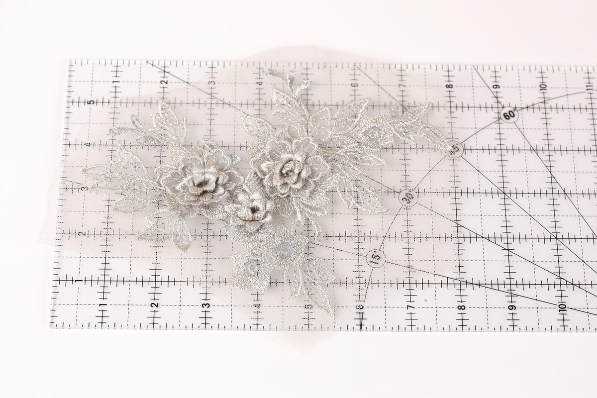 a close-up view of a clear ruler with a floral pattern on it.
