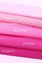 A stack of five fabric swatches in various shades of pink, including Rose 10, Neon Pink, Hot Pink, and Fuchsia 11.