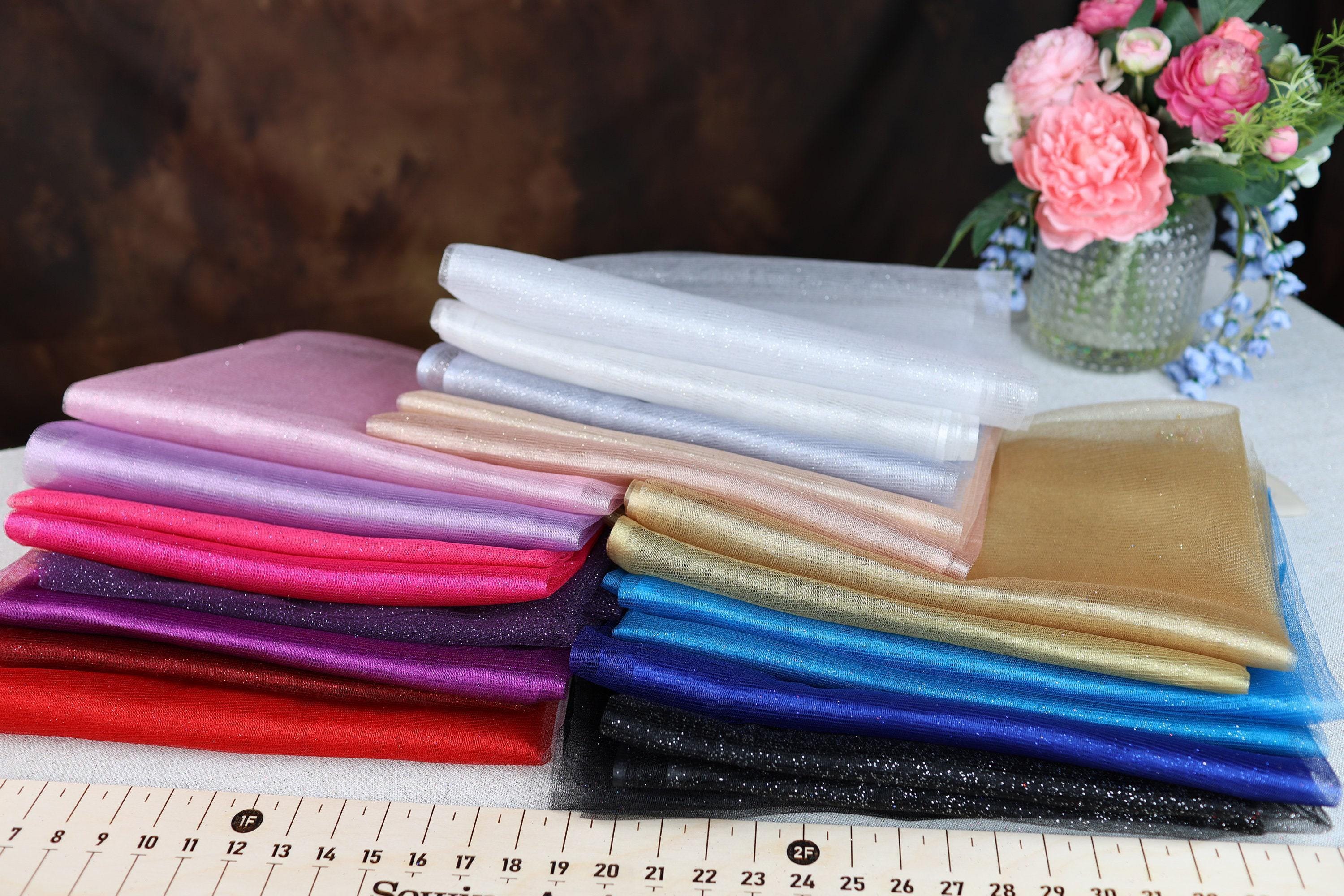 a stack of cloths sitting on top of a table