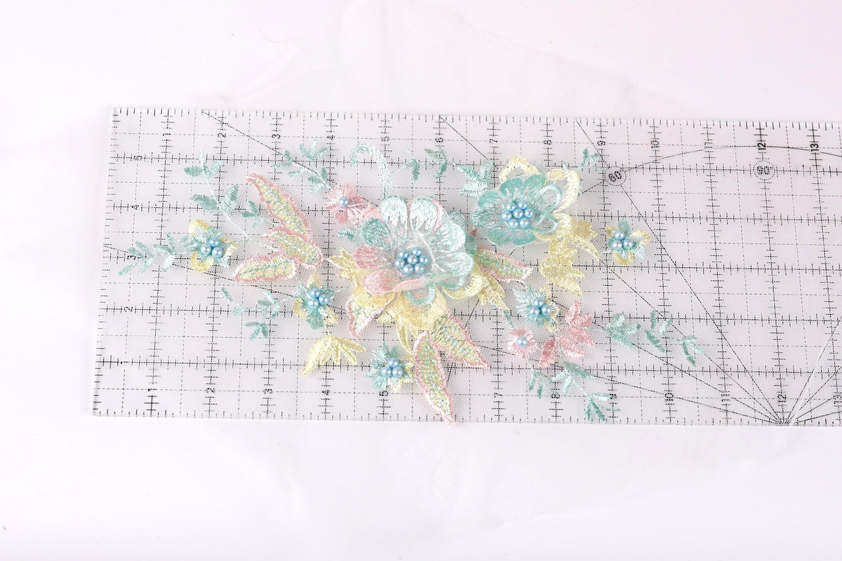 a clear ruler with a floral design on it, including various colored flowers and leaves.