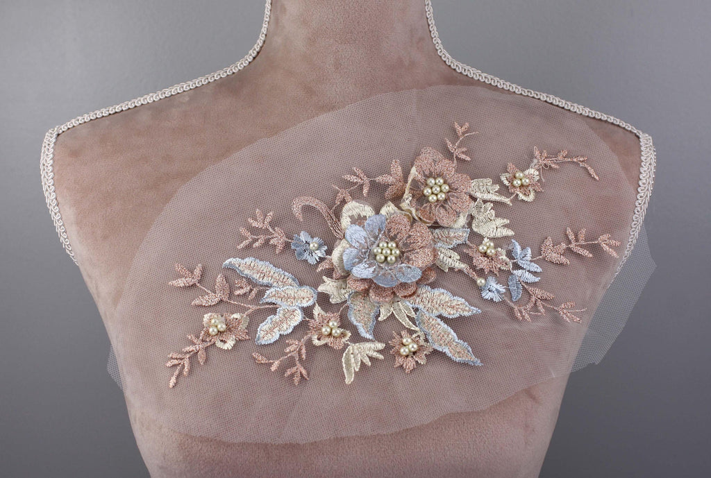 a mannequin with a pink dress with flowers on it