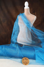 a close up of a mannequin wearing a blue scarf