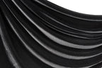 a close-up view of a shiny, black velvet fabric.