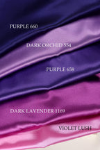 a collection of fabric swatches in various colors, including purple, dark purple, and pink.