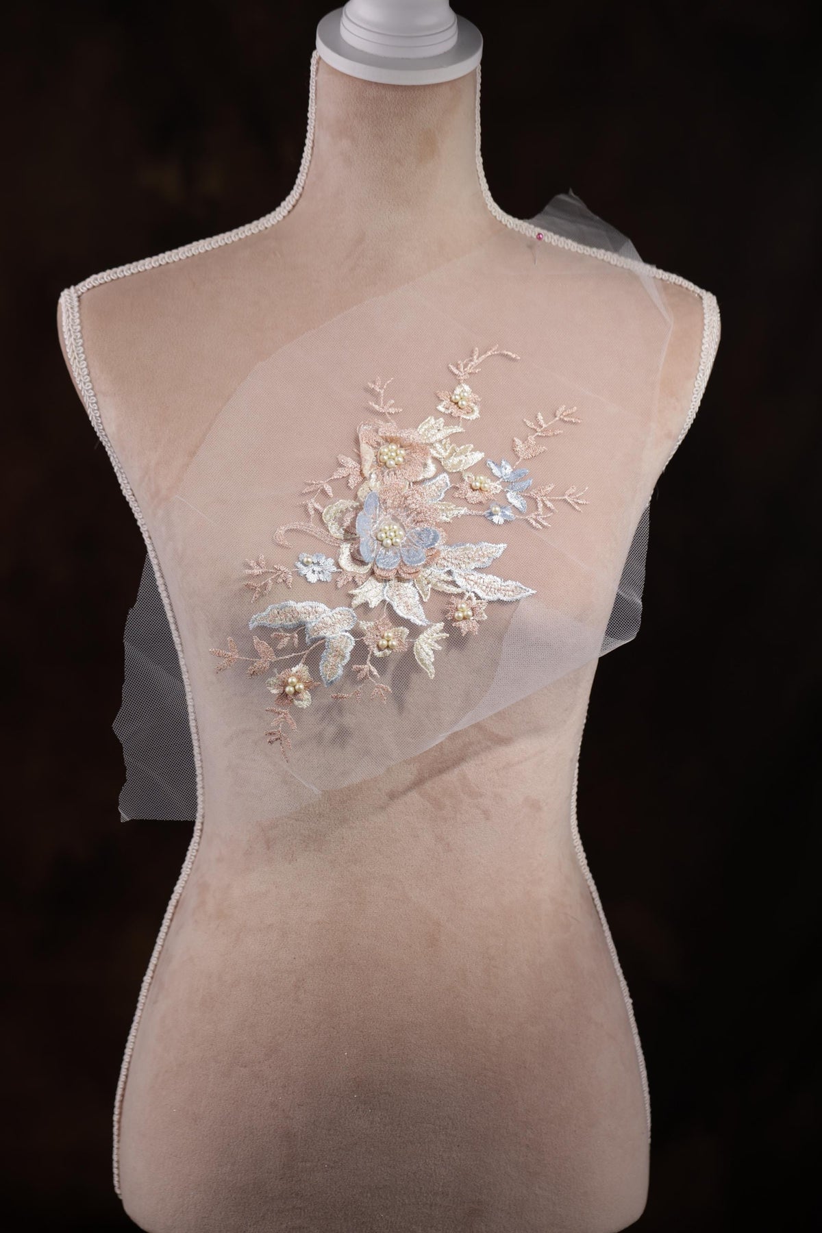 a close up of a piece of cloth with flowers on it