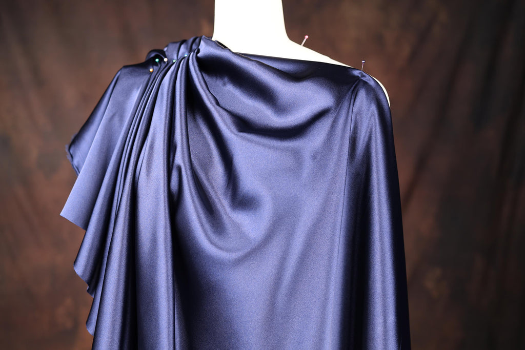 a woman's blue dress on a mannequin