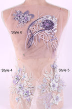 a mannequin with a pink background, wearing a dress with various purple and white floral embroidery pieces. The dress has two distinct styles: Style 6 with a larger floral design and Style 4 with a smaller floral design.