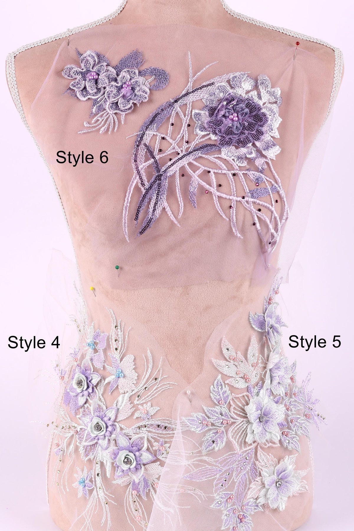 a mannequin with a pink background, wearing a dress with various purple and white floral embroidery pieces. The dress has two distinct styles: Style 6 with a larger floral design and Style 4 with a smaller floral design.