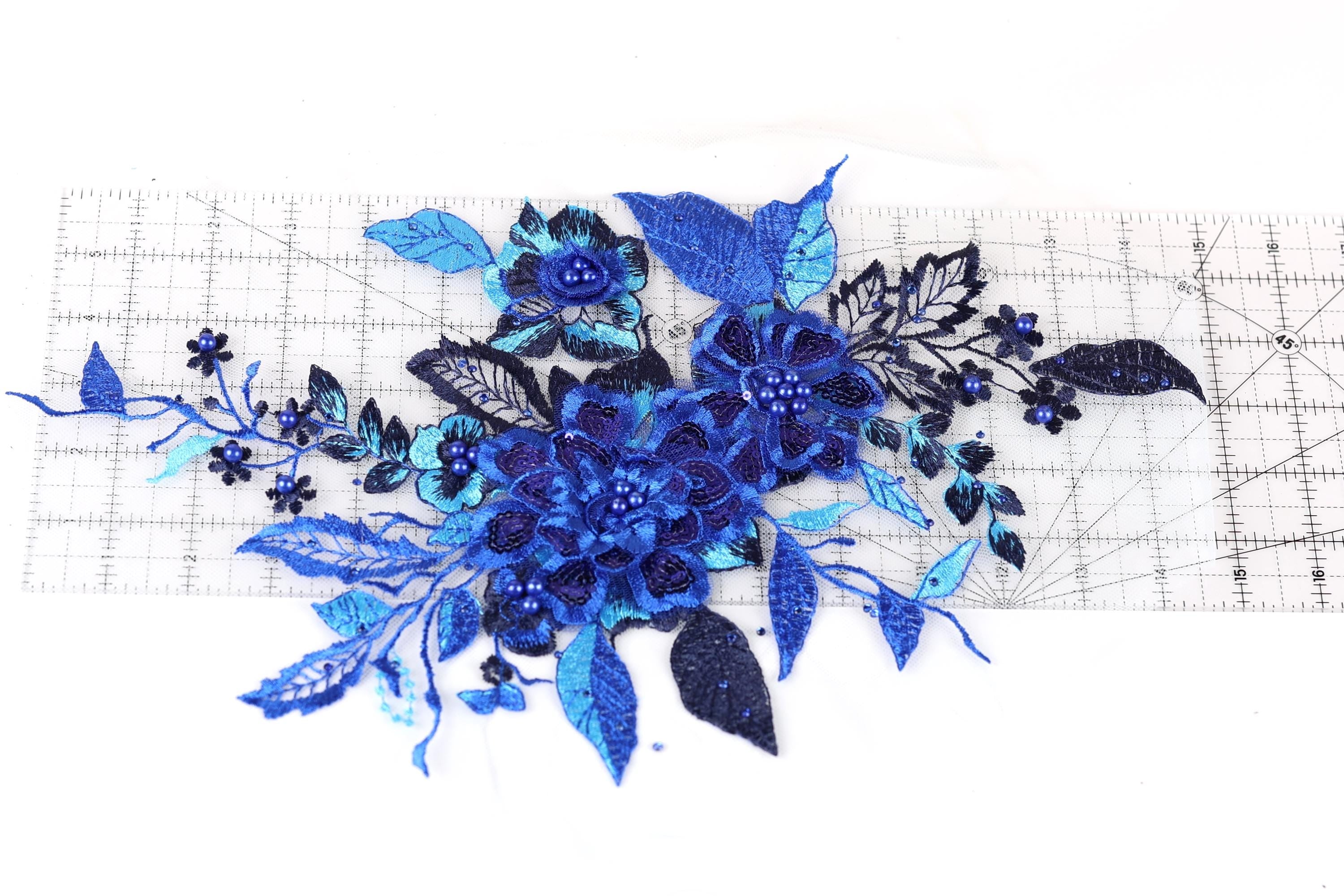 a close-up view of a blue floral arrangement with various blue flowers and leaves.