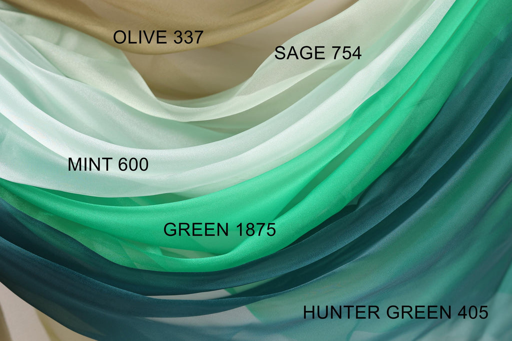a close-up view of a fabric with various shades of green, including mint, green, and hunter green.