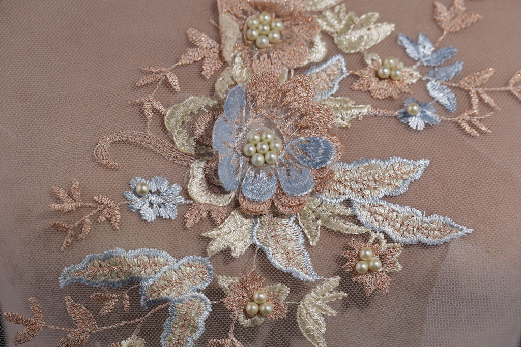 a close up of a piece of cloth with flowers on it