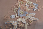 a close up of a piece of cloth with flowers on it