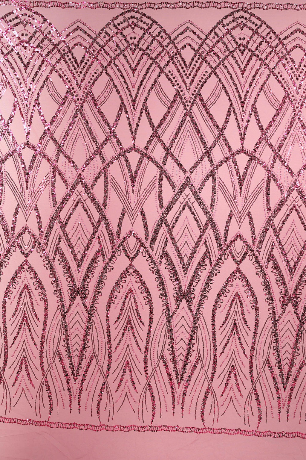 a pink fabric with a repeating pattern of black and pink lines and shapes, creating an intricate and visually striking design.