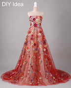 A red, strapless wedding dress with a long train and a floral pattern on the bodice and skirt.