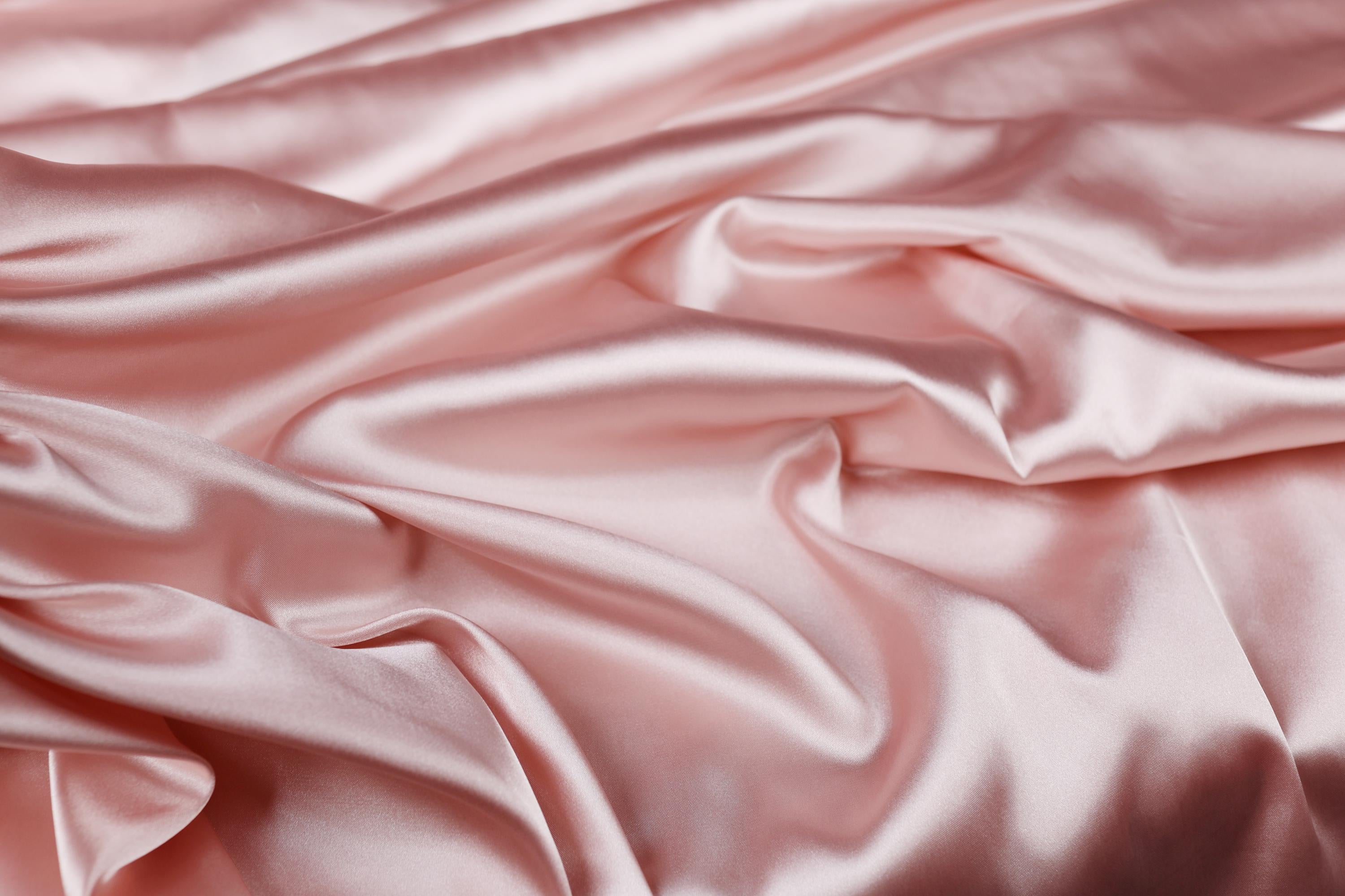 a close up of a pink satin fabric