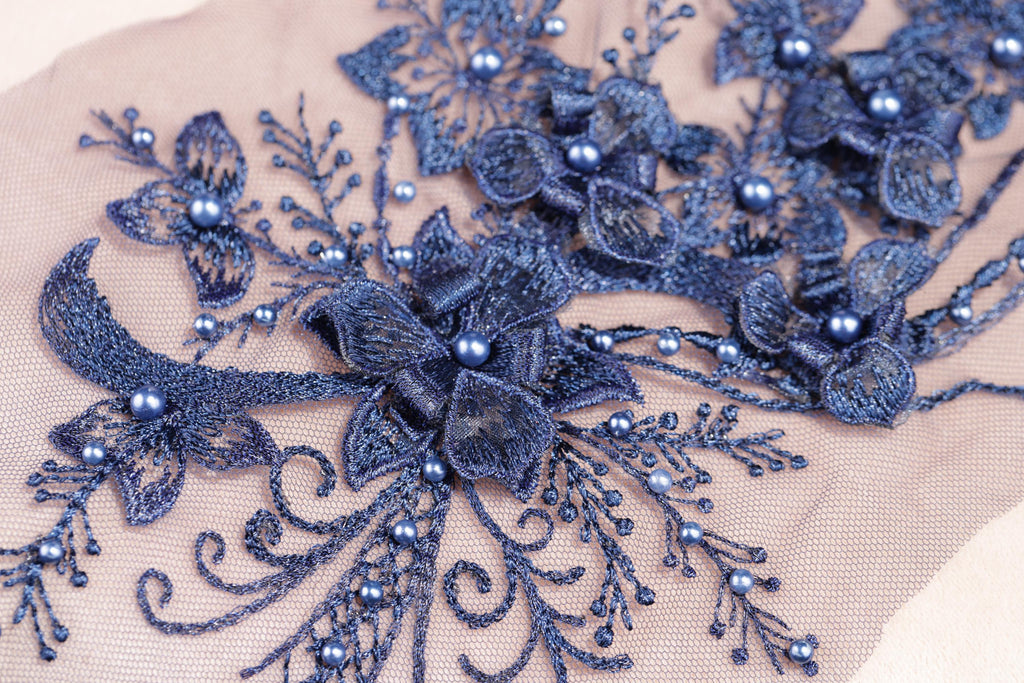 a close up of a piece of cloth with beads on it