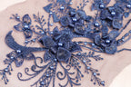 a close up of a piece of cloth with beads on it