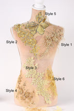A mannequin with various decorative elements, including gold and yellow floral patterns, attached to its torso.