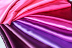 a bunch of different colors of satin fabric