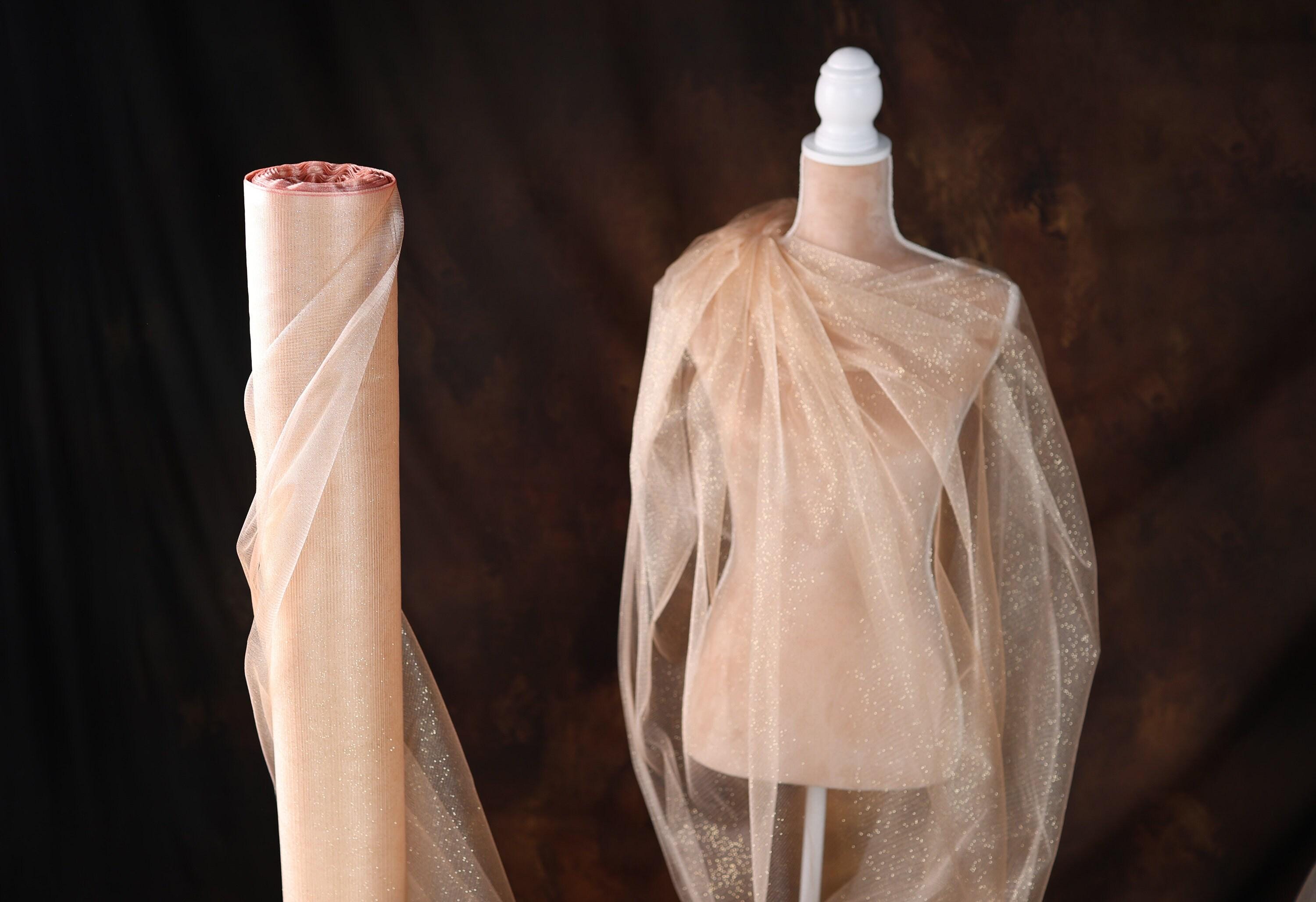 a mannequin with a veil on top of it