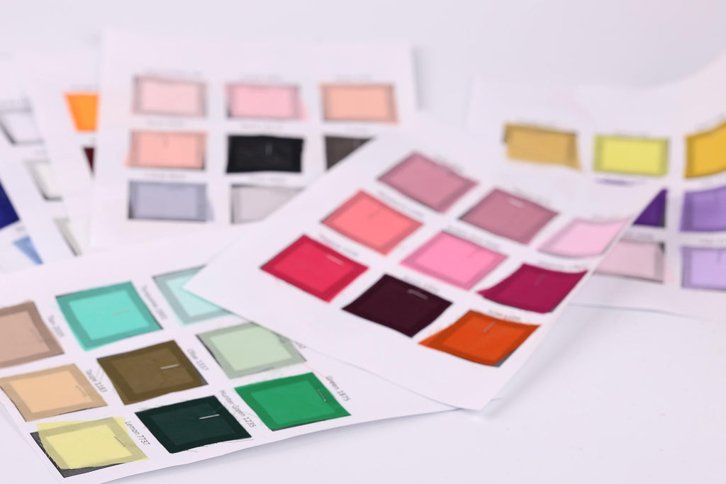 a collection of color swatches or samples, each with a different color displayed in a grid format. The swatches are arranged in a way that allows for easy comparison and identification of the various colors.
