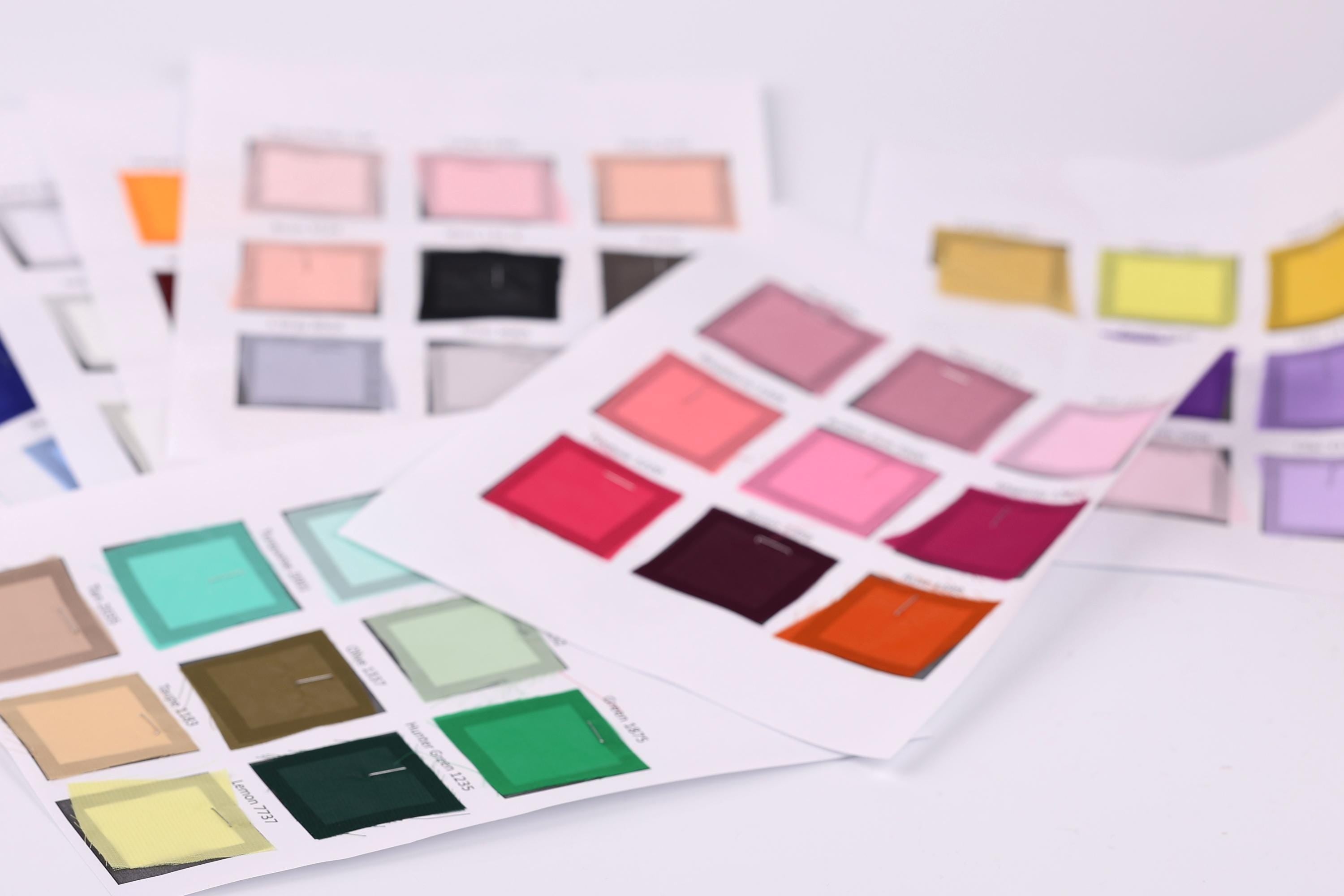 a collection of color swatches or samples, each with a different color displayed in a grid format. The swatches are arranged in a way that allows for easy comparison and identification of the various colors.