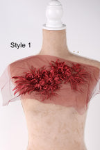 A mannequin wearing a red floral embroidered piece of fabric, with the text "Style 1" indicating the style of the embroidered piece.